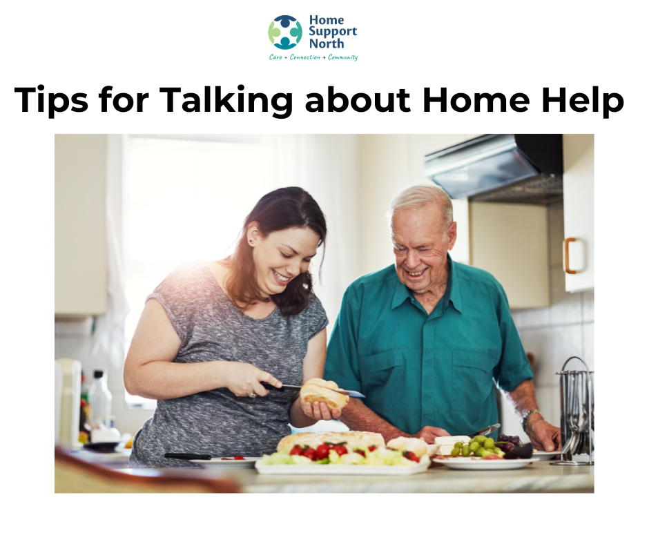 Aging father standing in the kitchen while daughter makes his sandwich