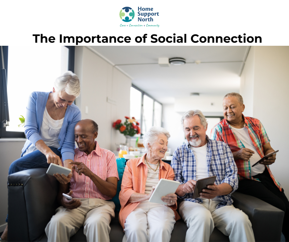 Diverse group of senior citizens sitting on couch and showing each other what is on their ipads.